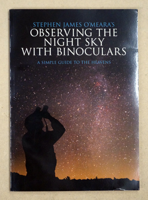 Observingthe night sky  with binoculars.
